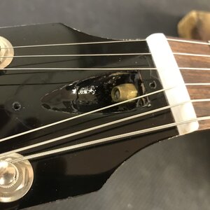 Repairing guitar to fix fret buzz