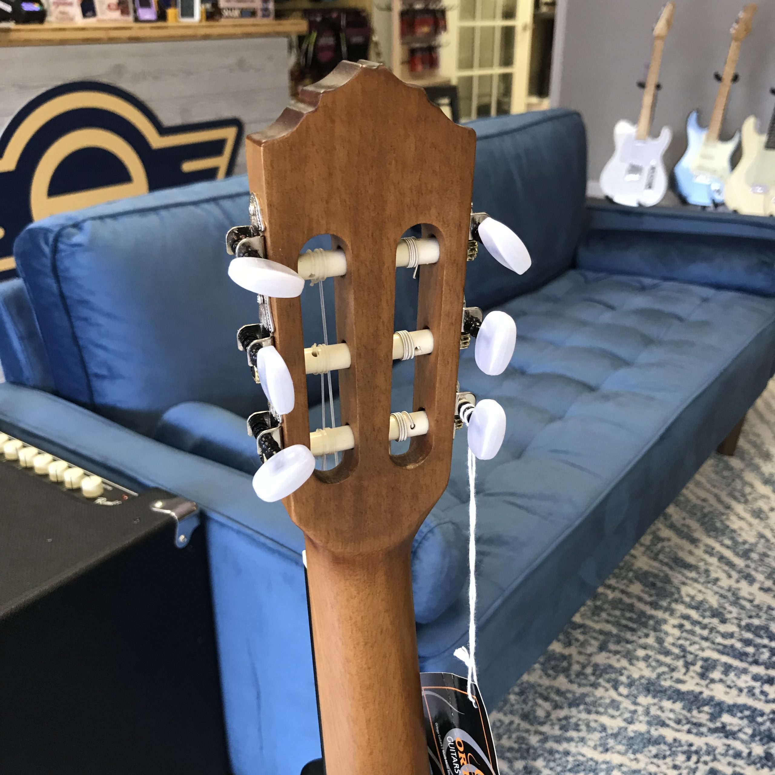 Picture of an Ortega R121-3/4 guitar, headstock rear
